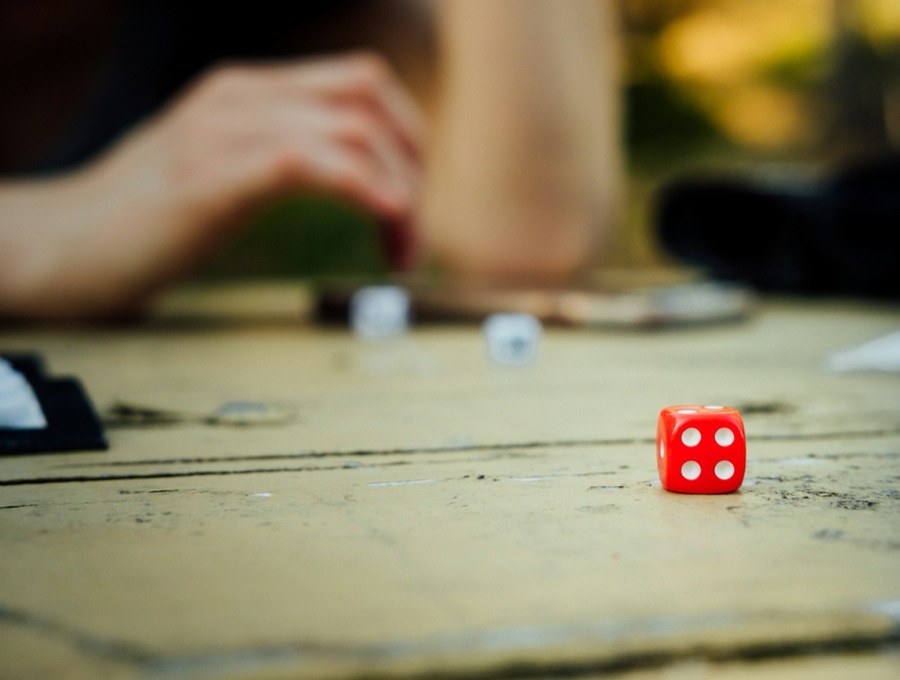 A family gathered around a table playing a board game together